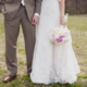groom with bride holding bouquet