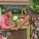 Engaged-couple-at-flower-standg