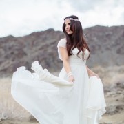 bride twirling wedding dress in califonia desert