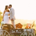 52-bride-and-groom-standing-on-carrigede-kissing-with-a-love-sign-at-Lindsey-Plantation-in-Greer-SC