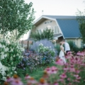 31 Green Villa Barn & Gardens, Oregon bride and groom shot out in the garden with flowers
