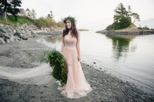 boho bride in pink dress on beach