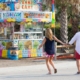 q-Women-pulling-her-fiance-along-to-the-pop-corn-stand-at-the-fair