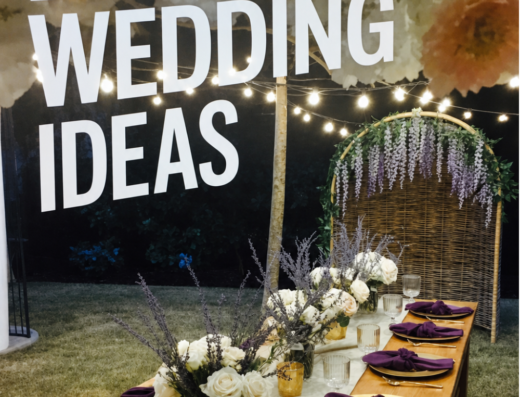 A decorated outdoor table with purple napkins, white flowers, and string lights beneath a floral arch; text reads "Backyard Wedding Ideas" and "Backyard Wedding with Gold and Purple Accents.