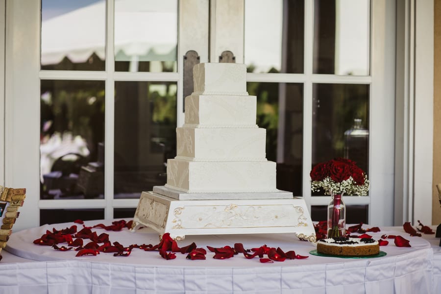 square traditional wedding cake on platter