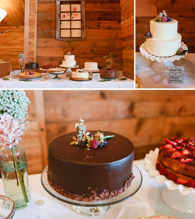 A dessert table features assorted cakes, showcasing various wedding cake styles like a chocolate cake with a deer topper, a classic white tiered cake, and a strawberry tart, all set in a rustic wooden room.