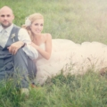 Bride and groom sitting in the lawn captured by One-12 Photography