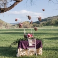 purple boho chic styled wedding outdoors