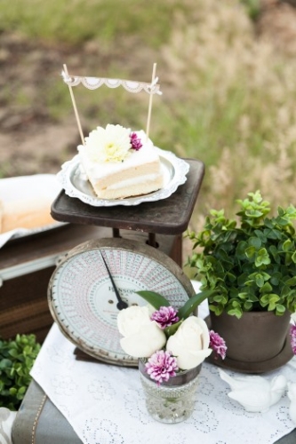 cake-piece-with-mini-bunting-on-old-scale