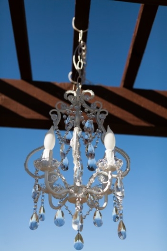 chandelier-hanging-from-wood-alter