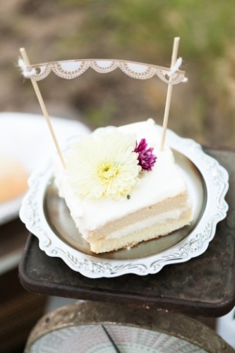 piece of cake with mini bunting on silver plate