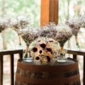 bouquets on wine barrel