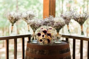 bouquets on wine barrel
