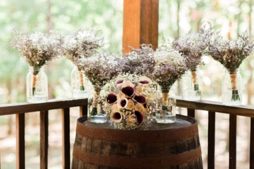 bouquets on wine barrel