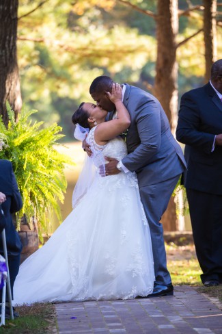 bride and groom kiss