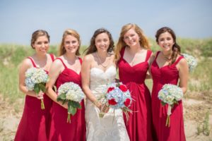 bridesmaids in bright red dresses