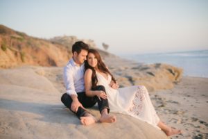 engaged couple on rocks