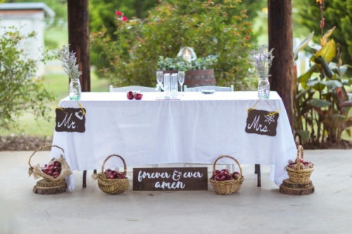 head table with baskets of apples
