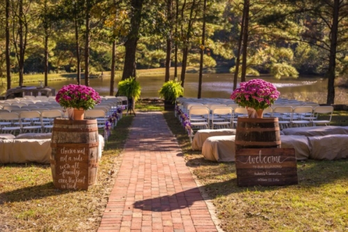 outdoor ceremony with wine barrel at entrance