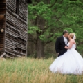 newlyweds near old wood shed