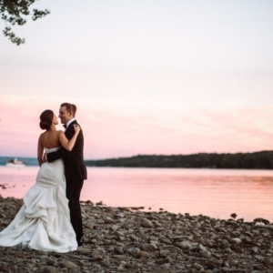 kissing on beach with sunset