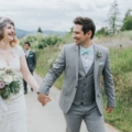 bride and groom hold hands