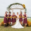 bridesmaids in dark purple dresses and boots