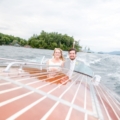 streamlined view of newlyweds in speed boat