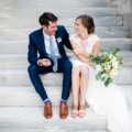newlyweds on steps of The Powel House