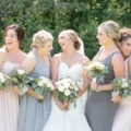 bridesmaids in different tones of dresses