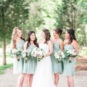 bridesmaids in light sage dresses