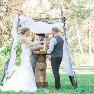 couple at alter enjoy beer together