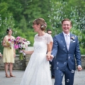 newlyweds walk down aisle with bubbles