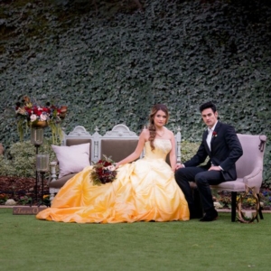 belle and prince adam on vintage chairs outdoors