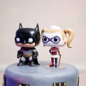 cartoon batman and wonder woman cake topper