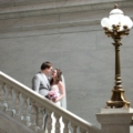 newlyweds on staircase with lamp