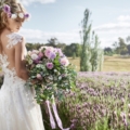 styled bride with bouquet in lavender field