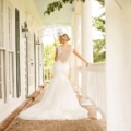 bride with parasol on porch