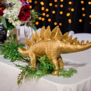 gold stegosaurus on table