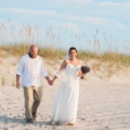 newlyweds on sandy beach