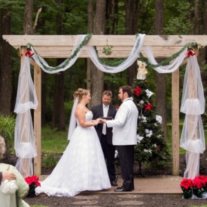 bride and groom at xmas alter