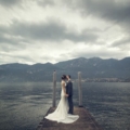 newlyweds on dock at Lake Como