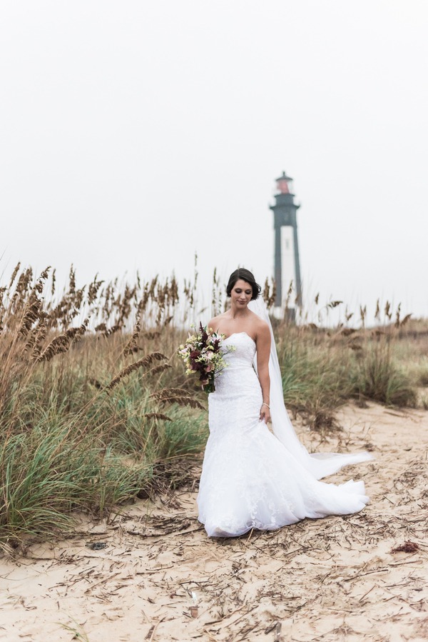 Bride in strapless lace mermaid gown at First Landing State Park beach