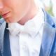 groom in white bow tie