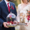 couple holding styled beauty and beast decor