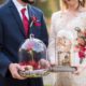 couple holding styled beauty and beast decor