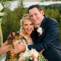 groom with bride holding pet cat