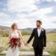 styled couple hold hands outdoors