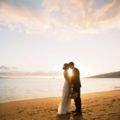 newlyweds at sunset