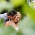 peaking through vines at newlyweds